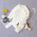 Knitted solid color baby jumpsuit