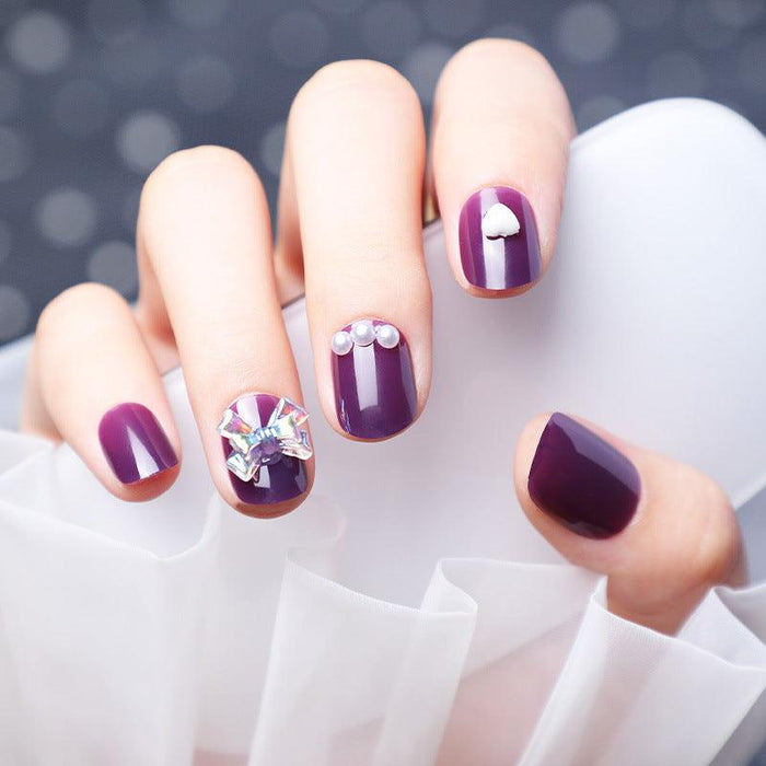 Wearing Nails With Diamonds And Purple Fake Nails