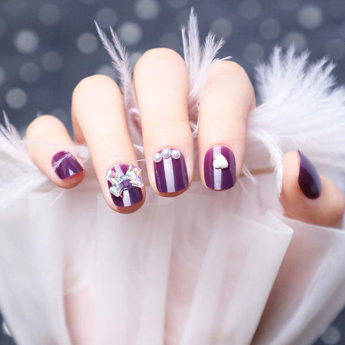 Wearing Nails With Diamonds And Purple Fake Nails
